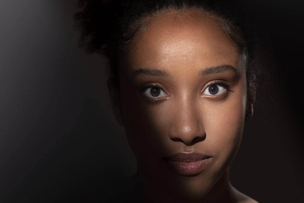 portrait of beautiful black woman with mysterious shadows